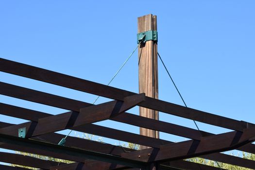 Structural detail of a modern wooden patio pergola canopy, Cape Town, South Africa