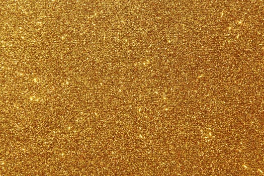 The picture shows a background with golden glittery paper