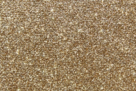 The picture shows a background with golden glittery paper