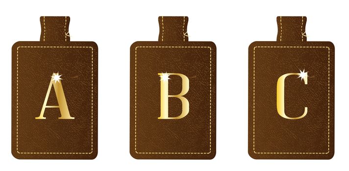 A brown leather key fob and ring set embosed with a gold leaf alphabet letter