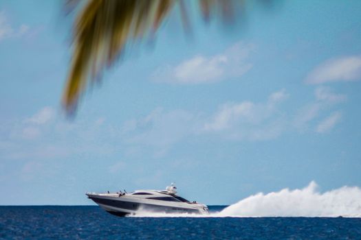 Motorboat speeds over the sea in the Dominicus coast in the Dominican Republic
