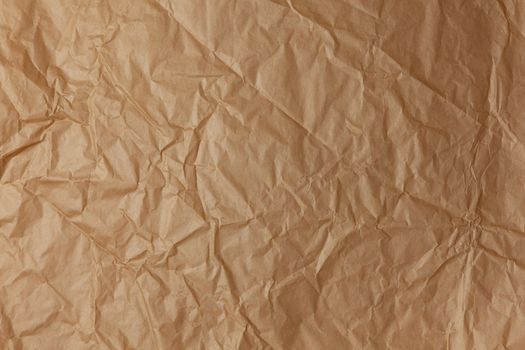 Abstract texture. Crumpled craft brown paper background. Copy space for text. Horizontal. DIY, handicraft, back to school, ecology, plastic free concept, harvesting for mock up. Flat lay, top view.