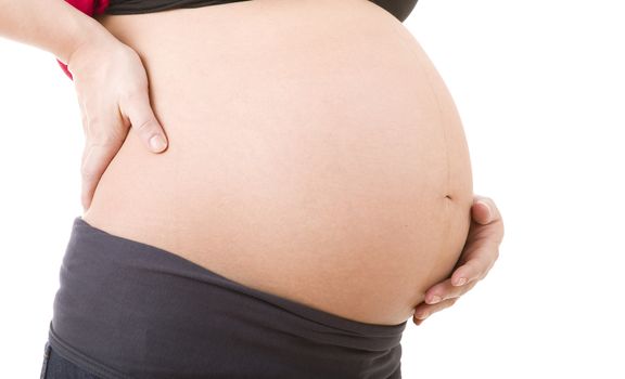 Closeup of pregnant woman at white background