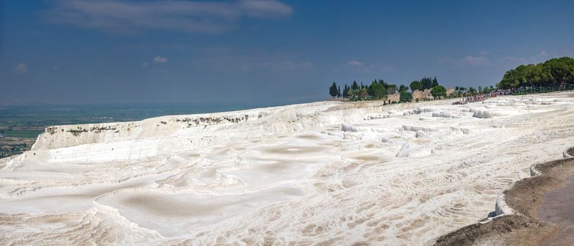 Pamukkale, Turkey – 07.15.2019. White limestone mineral fields in Pamukkale, Turkey, on a sunny summer day.