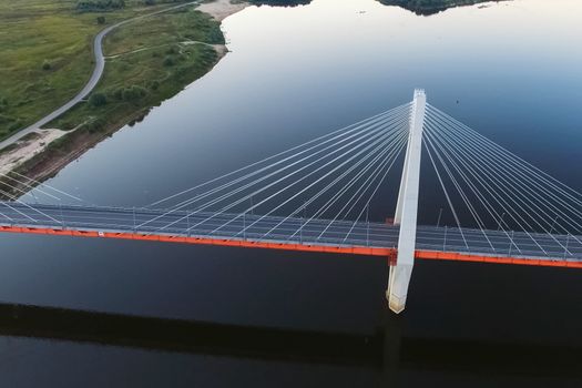 Beautiful bridge over the river. The bridge on the cables is road.