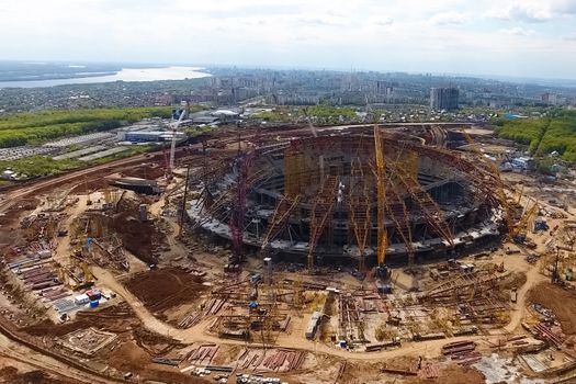 Moscow, Russia - May 12, 2018: Equipment for the construction of the stadium. Tower cranes and construction machinery. Construction of the stadium.