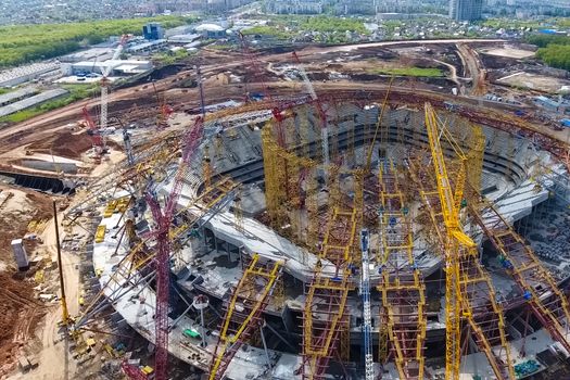 Moscow, Russia - May 12, 2018: Equipment for the construction of the stadium. Tower cranes and construction machinery. Construction of the stadium.