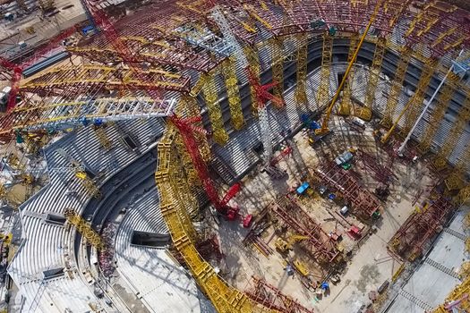 Moscow, Russia - May 12, 2018: Equipment for the construction of the stadium. Tower cranes and construction machinery. Construction of the stadium.