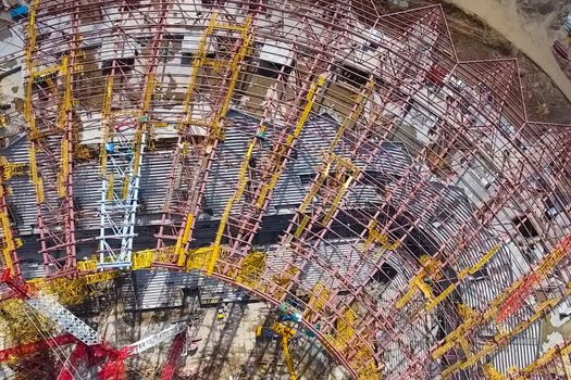 Moscow, Russia - May 12, 2018: Equipment for the construction of the stadium. Tower cranes and construction machinery. Construction of the stadium.