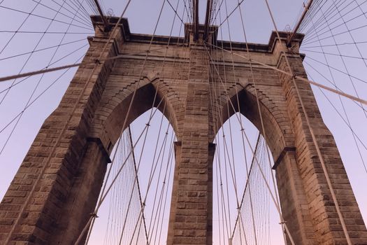 The Brooklyn Bridge. Walk on the bridge. Walking through the streets of New York, Manhattan. The life of New York in the afternoon. Streets and city buildings.