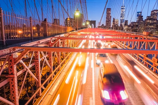 Night lights of car headlamps on the Brooklyn bridge. Long exposure.