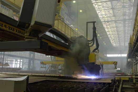 Novorossiysk, Russia - May 26, 2018: Automatic laser welding machine at the shipyard. Shipbuilding plant, Internal welding workshop m erection of metal structures. The plant in Novorossiysk.