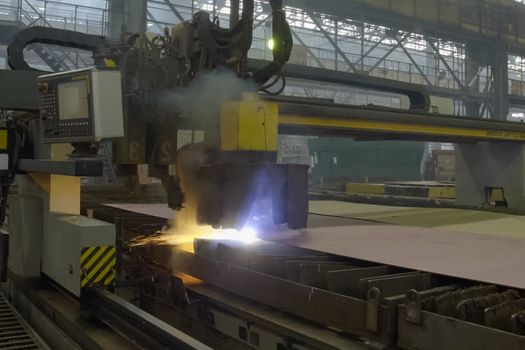 Novorossiysk, Russia - May 26, 2018: Automatic laser welding machine at the shipyard. Shipbuilding plant, Internal welding workshop m erection of metal structures. The plant in Novorossiysk.