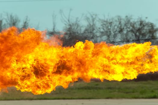 Flame tongues from the flamethrower. background of fire.