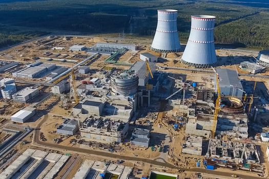 Aerial survey of a nuclear power plant under construction. Installation and construction of a power plant. Nuclear power.