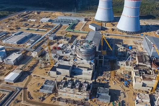 Aerial survey of a nuclear power plant under construction. Installation and construction of a power plant. Nuclear power.