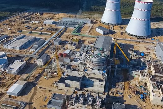 Aerial survey of a nuclear power plant under construction. Installation and construction of a power plant. Nuclear power.