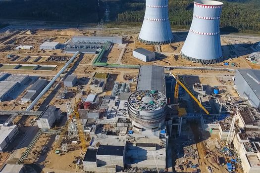 Aerial survey of a nuclear power plant under construction. Installation and construction of a power plant. Nuclear power.