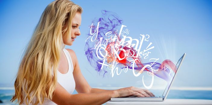 Pretty blonde using her laptop at the beach against letters and smoke