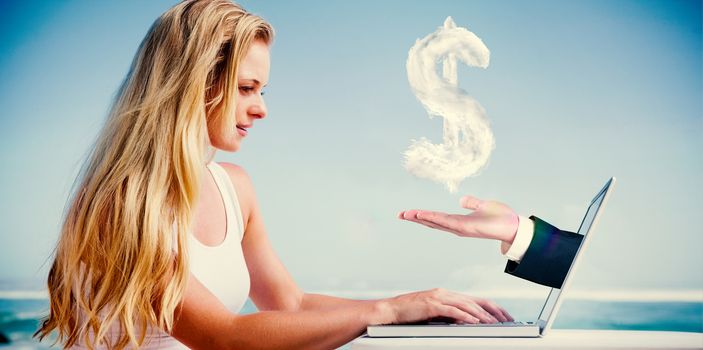 Composite image of pretty blonde using her laptop at the beach with hand presenting cloud dollar