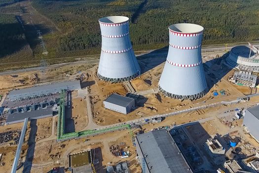 Aerial survey of a nuclear power plant under construction. Installation and construction of a power plant. Nuclear power.