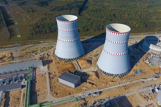 Aerial survey of a nuclear power plant under construction. Installation and construction of a power plant. Nuclear power.