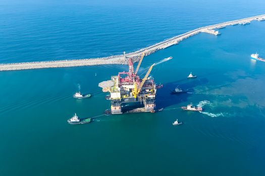 Drilling platform in the port. Towing of the oil platform.