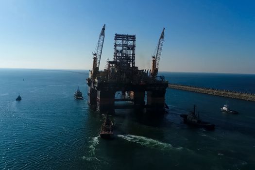 Drilling platform in the port. Towing of the oil platform.