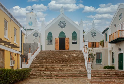 An old catholic church at the top of a brick staircase