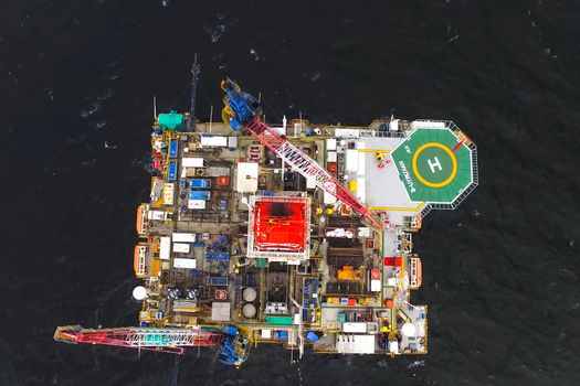 Oil offshore platform in the sea. Extraction of oil on the shelf.