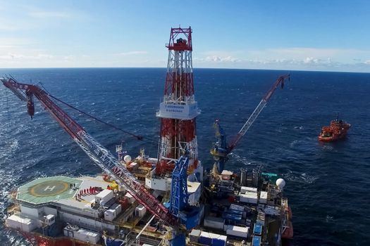 Oil offshore platform in the sea. Extraction of oil on the shelf.