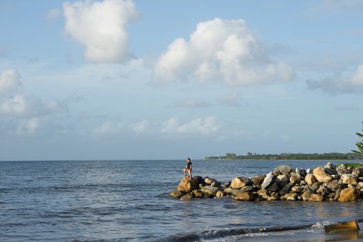 Man standing on the rocks looking at the awesome view