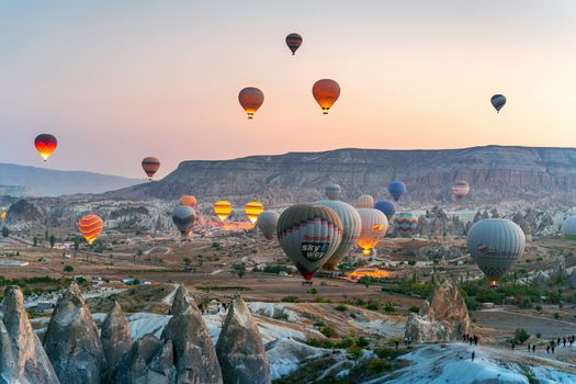 Colorful hot air balloon flying over Cappadocia, Turkey.