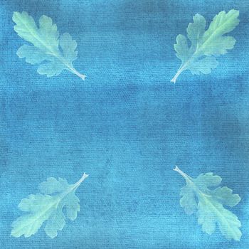 Chrysanthemum leaves on blue watercolor background. Ornate, card, frame.