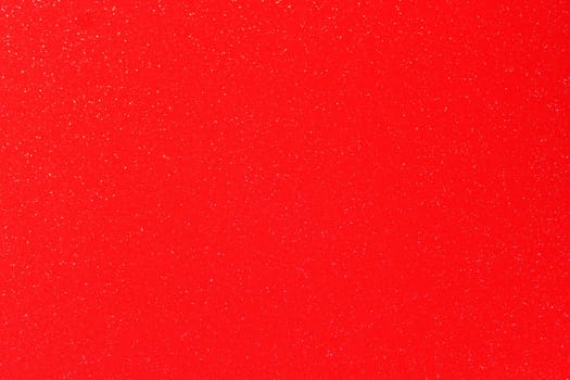 The picture shows a background with red glittery paper
