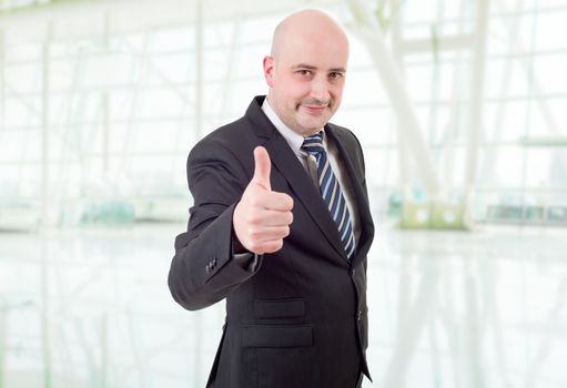 young business man going thumb up, at the office