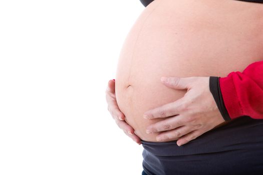 Closeup of pregnant woman at white background