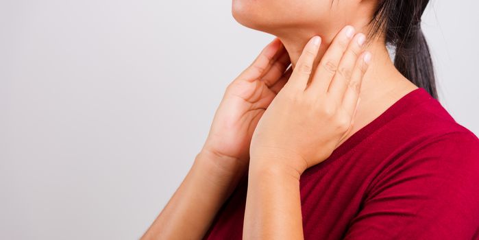 Asian beautiful woman itching her scratching her itchy neck on white background with copy space, Medical and Healthcare concept