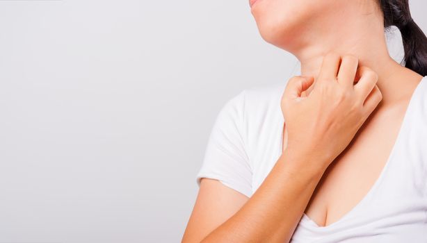 Asian beautiful woman itching her useing hand scratch itch neck on white background with copy space, Medical and Healthcare concept