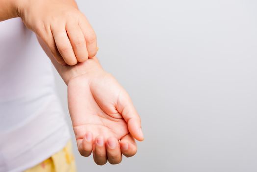 Asian beautiful woman itching her useing hand scratch itch hand on white background with copy space, Medical and Healthcare concept