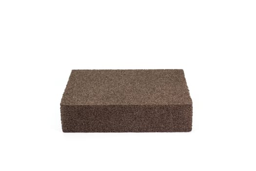 The close up of polishing sandpaper rough sponge block for kitchenware cleaning.