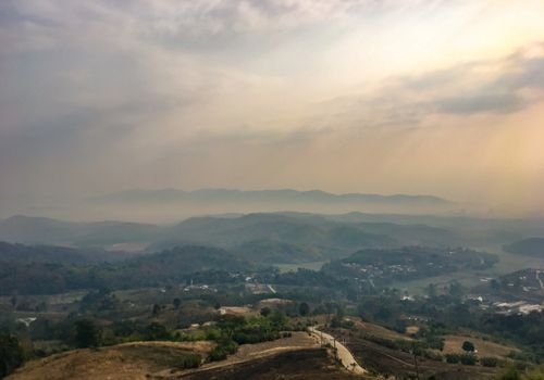 The landscape of mountains is full of clouds and fog. A top view of the haze in the mountains And fog in the morning at Doi Sako Mountain, Chiang Saen, Thailand