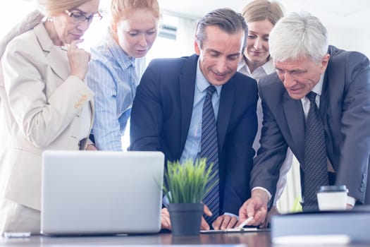 Team work process, business people sign contract documents standing near the table