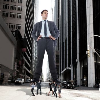 Composite image of business team supporting boss against new york street