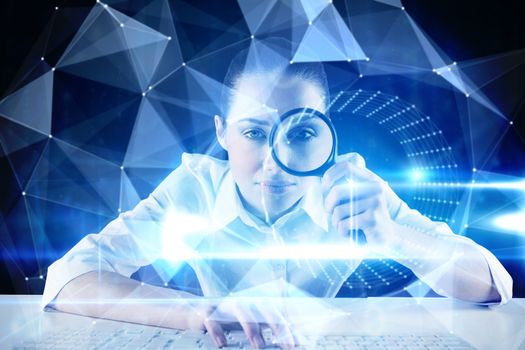 Businesswoman typing and looking through magnifying glass against blue technology design with tunnel