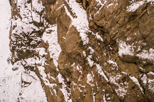 Hillside of a mountain in winter seasonal landscape in a winter frosty weather.