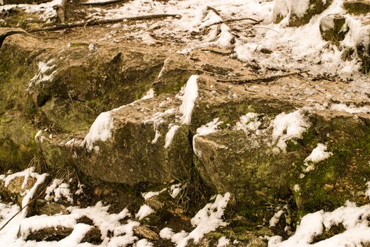 Cliff of a mountain in a winter snowy, frosty weather. Mountain with snow in winter