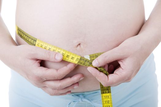 Closeup of pregnant woman at white background