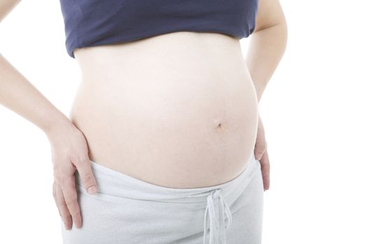 Closeup of pregnant woman at white background