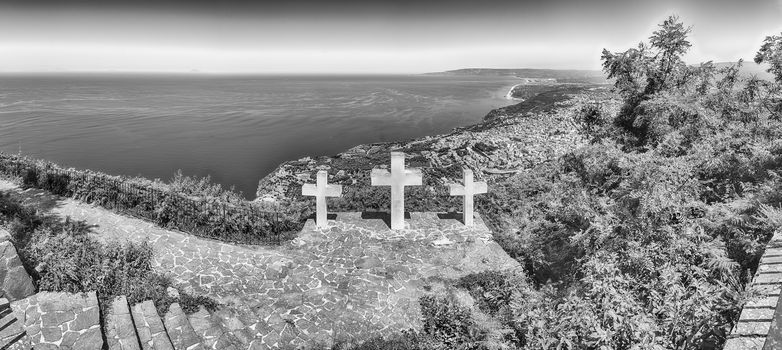 The iconic Three Crosses on the top of Mount Sant'Elia overlooking the town of Palmi on the Tyrrhenian Sea, Italy